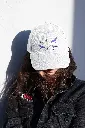 dad-hat-mockup-of-a-woman-with-a-patched-denim-jacket-27033.webp